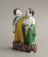 A Chinese biscuit-decorated figure group in susancai colours of the HeHe Erxian, Kangxi period