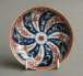 A Chinese export teabowl and saucer with Meissen mak to the teabowl, Qianlong period