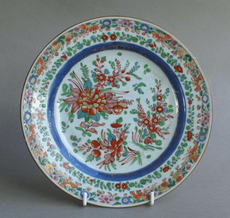 A famille rose Chinese eport plate with carved decoration, dating from the Yongzheng to early Qianlong period, with later English overglaze enamels