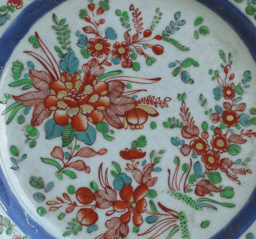 A famille rose Chinese eport plate with carved decoration, dating from the Yongzheng to early Qianlong period, with later English overglaze enamels