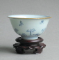 A Chinese Transitional period bowl, decorated in a calligraphic style with precious object