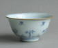 A Chinese Transitional period bowl, decorated in a calligraphic style with precious object