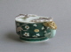 An attractive Chinese cup with leopard handles, decorated on the biscuit with susancai famille verte colours